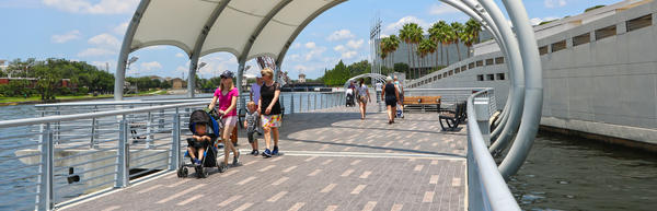 Women Pushing a Stroller on Riverwalk