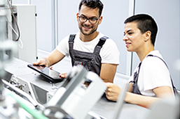Workers operating machines